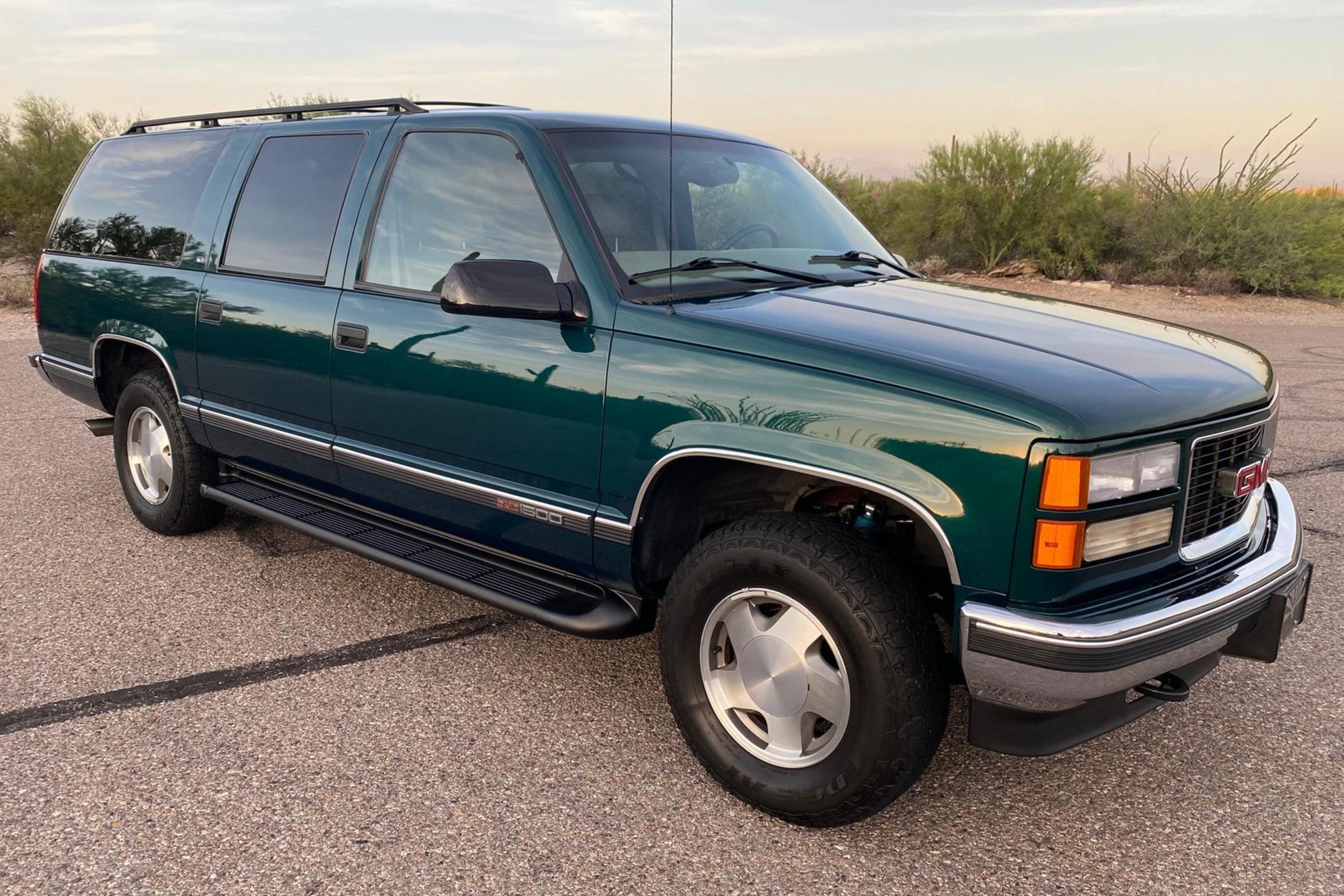 1998 GMC Suburban sold at auction for $13,500